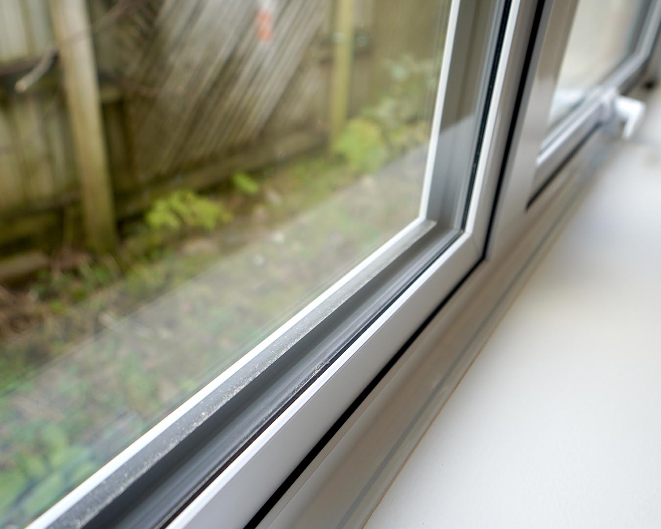 Close-up of aluminium window seal and frame joinery detail