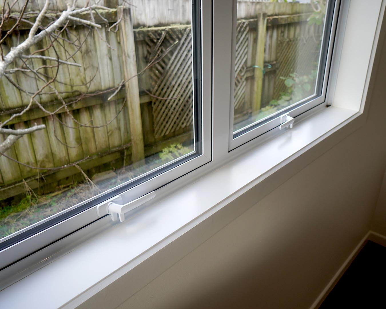 Close-up of aluminium window frame and handle on Auckland home
