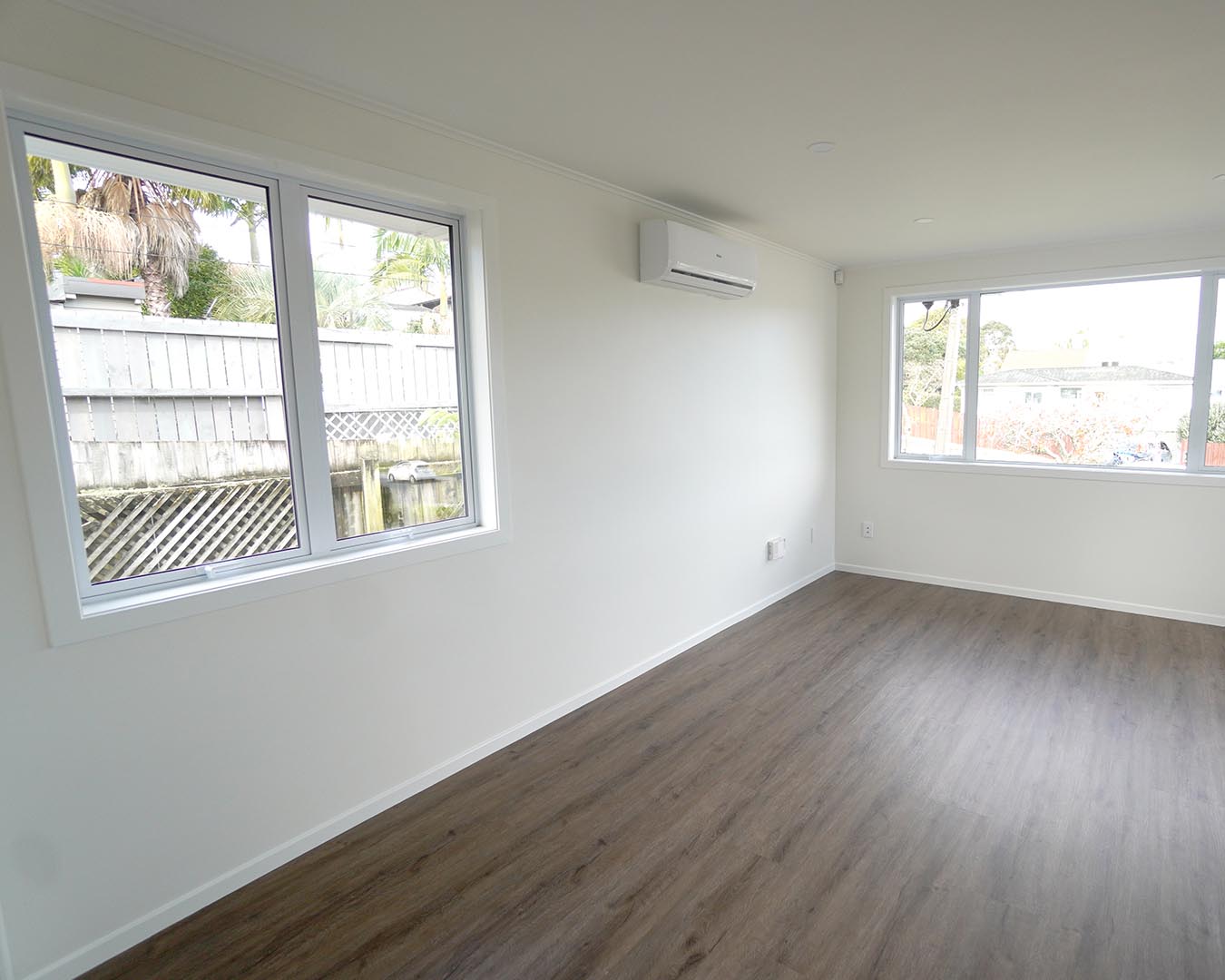 Newly installed aluminium windows in bright Auckland bedroom